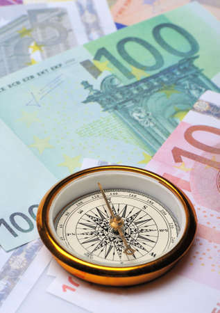 Euro and compass. Concept about a direction in businessの写真素材