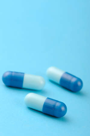 set capsules on blue background. Photo closeupの写真素材
