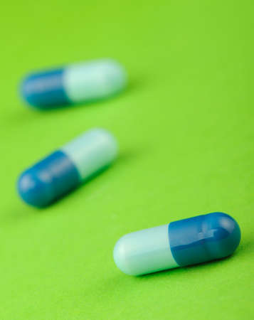 set capsules on green background. Photo closeupの写真素材