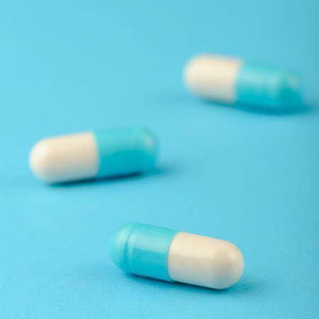 set capsules on blue background. Photo closeupの写真素材