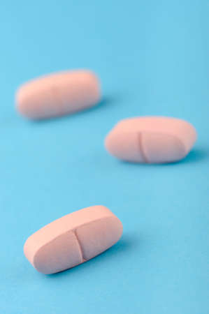 set capsules on blue background. Photo closeupの写真素材