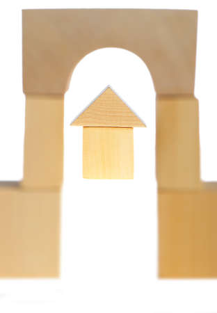 The wooden house. Children's toys - wooden cubes. It is isolated on a white backgroundの写真素材