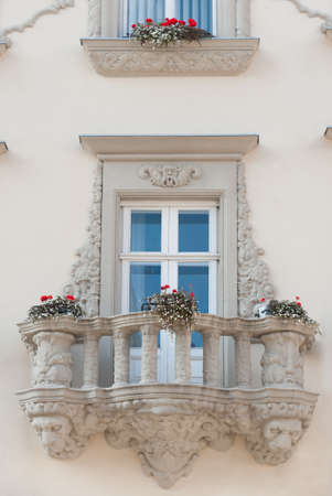 Facade of a building with a balcony and flowers. The building is constructed 1850-1890の写真素材