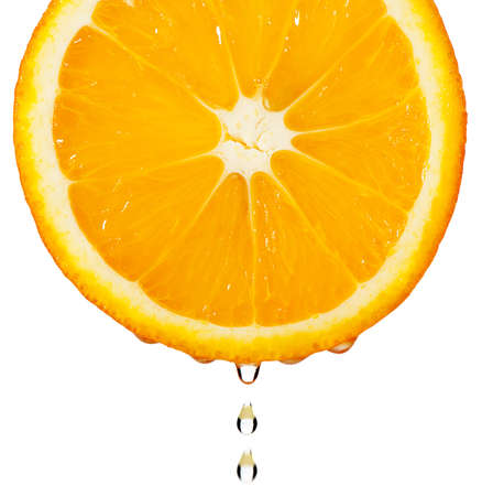 Section orange with drop. The detailed photo on a gleam. It is isolated on a white background