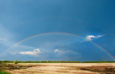 Rainbow. A landscape with a rain and a rainbow.の写真素材