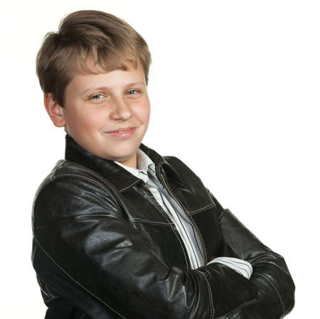 Portrait of the teenager in a leather jacket. It is isolated on a white backgroundの写真素材
