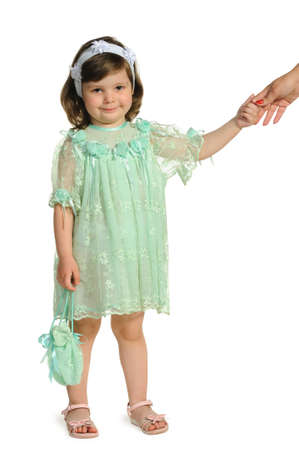 The little girl holds a hand of mother. It is isolated on a white backgroundの写真素材