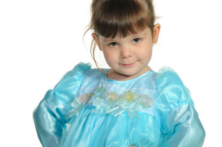 Pretty the little girl in a blue dress. It is isolated on a white backgroundの写真素材