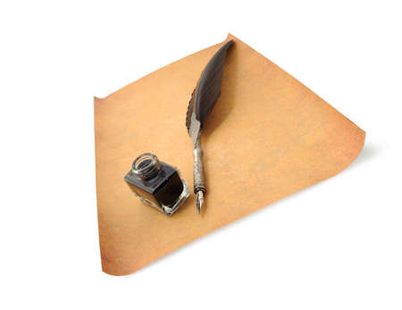 Feather quill and inkwell on an old paper. Perspective viewの写真素材