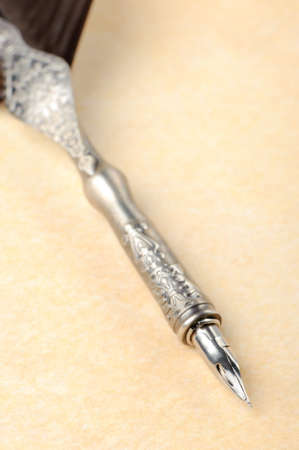 Feather quill an old paper. Photo closeupの写真素材