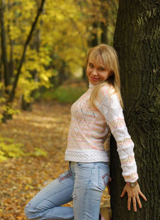 The girl on a background autumn forest. The blonde, 24 yearsの写真素材