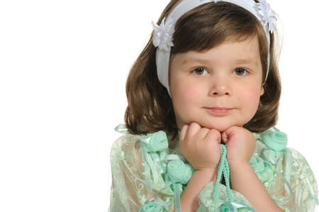 The lovely little girl close up. It is isolated on a white backgroundの写真素材