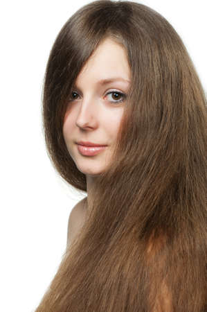 The beautiful girl with long healthy hair. It is isolated on a white backgroundの写真素材