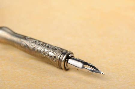 Feather quill an old paper. Photo closeupの写真素材