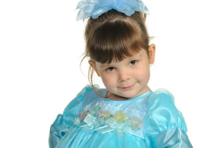 Pretty the little girl in a blue dress. It is isolated on a white backgroundの写真素材