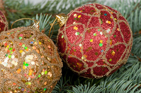 Christmas toys on branches of a fur-tree. Celebratory backgroundの写真素材