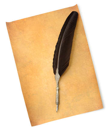 Feather quill an old paper. Isolated on whiteの写真素材