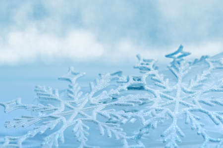 Snowflake big close up. Bokeh a background. Toning is blueの写真素材