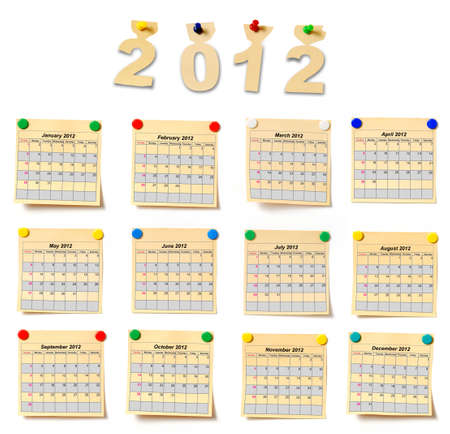 calendar on set note 2012. Paper a note attached to a wall buttons, it is isolated on a white...