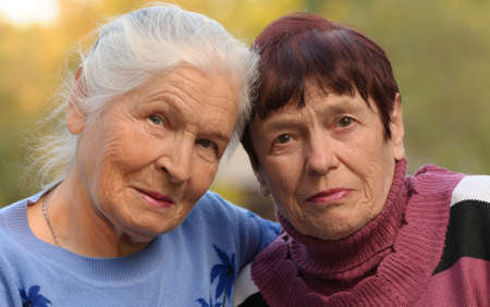 Two sisters of old age. A photo on outdoorsの写真素材