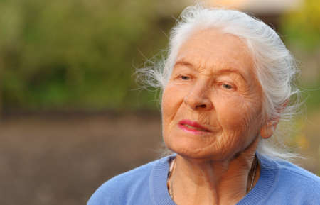 Portrait of the elderly woman. A photo on outdoorsの写真素材