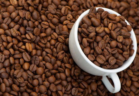 White cup with coffee grains. A photo close upの写真素材