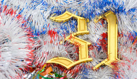 Gold figures 31. Figures lie on a celebratory tinsel.Concept eve of New Yearの写真素材