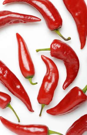 Red bitter pepper. It is spread randomly out on a white backgroundの写真素材