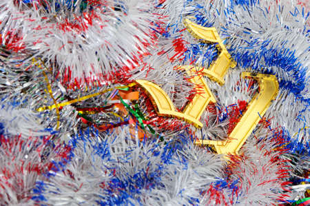 Gold figures 31. Figures lie on a celebratory tinsel.Concept eve of New Yearの写真素材