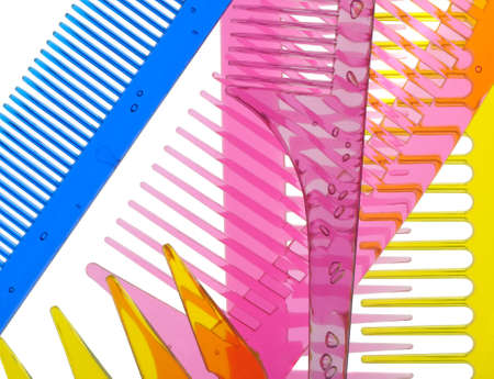 Set multi-coloured transparent combs. It is photographed on a gleam. It is isolated on a white backgroundの写真素材