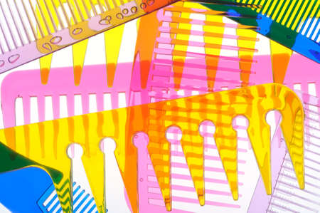 Set multi-coloured transparent combs. It is photographed on a gleam. It is isolated on a white backgroundの写真素材
