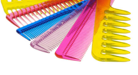 Set multi-coloured transparent combs. It is photographed on a gleam. It is isolated on a white...