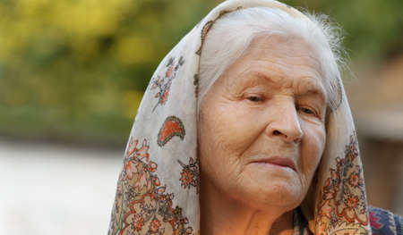 Portrait of the elderly woman. A photo on outdoorsの写真素材