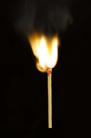 Burning match. A photo of the moment of ignition of a matchの写真素材