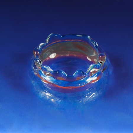 Splash water. High-speed shooting, a blue backgroundの写真素材