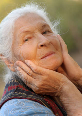 Portrait of the elderly woman. A photo on outdoorsの写真素材