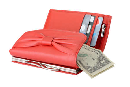 Red leather wallet with dollars and credit cards. It is isolated on a white background