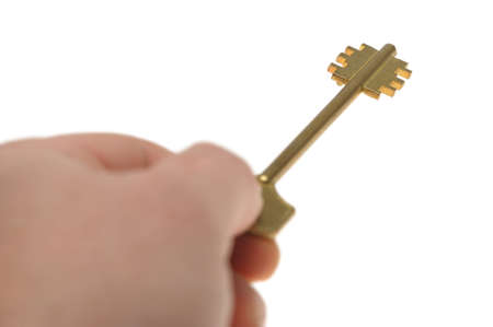 Key in a hand. Selective focus. It is isolated on a white backgroundの写真素材