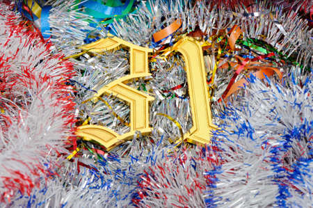 Gold figures 31. Figures lie on a celebratory tinsel.Concept eve of New Yearの写真素材