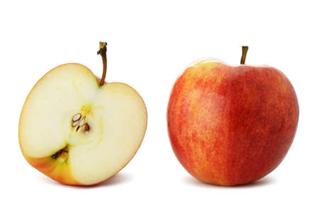 The cut and whole apple. A detailed photo of fruit on a white backgroundの写真素材