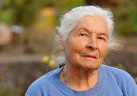 Portrait of the elderly woman. A photo on outdoorsの写真素材