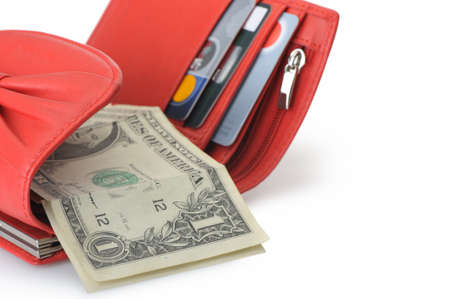 Red leather wallet with dollars and credit cards. It is isolated on a white backgroundの写真素材