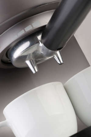 Coffee machine espresso. Two white cups and the equipment for coffee preparation. A close upの写真素材