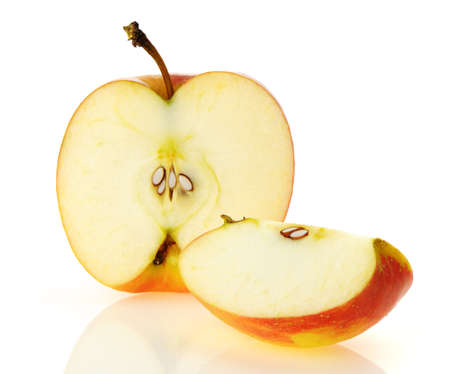 The cut apple. A detailed photo of fruit on a white backgroundの写真素材