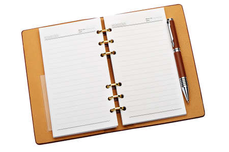 Open notebook with copper binding and stylish pen. It is isolated on a white backgroundの写真素材
