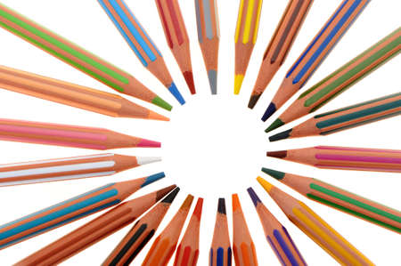 Set of plastic colour pencils located on a circle. It is isolated on a white backgroundの写真素材