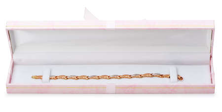 Gold bracelet in gift packing. It is isolated on a white backgroundの写真素材