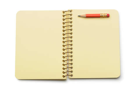Notebook yellow paper and red pencil. Isolated on whiteの写真素材