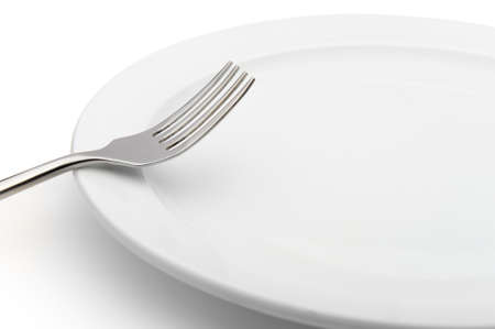 fork on a plate. It is isolated on a white backgroundの写真素材