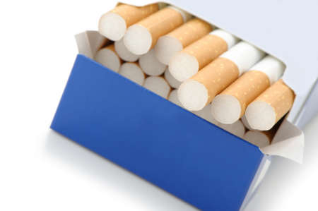Pack of cigarettes with cigarettes sticking out isolated on white.の写真素材